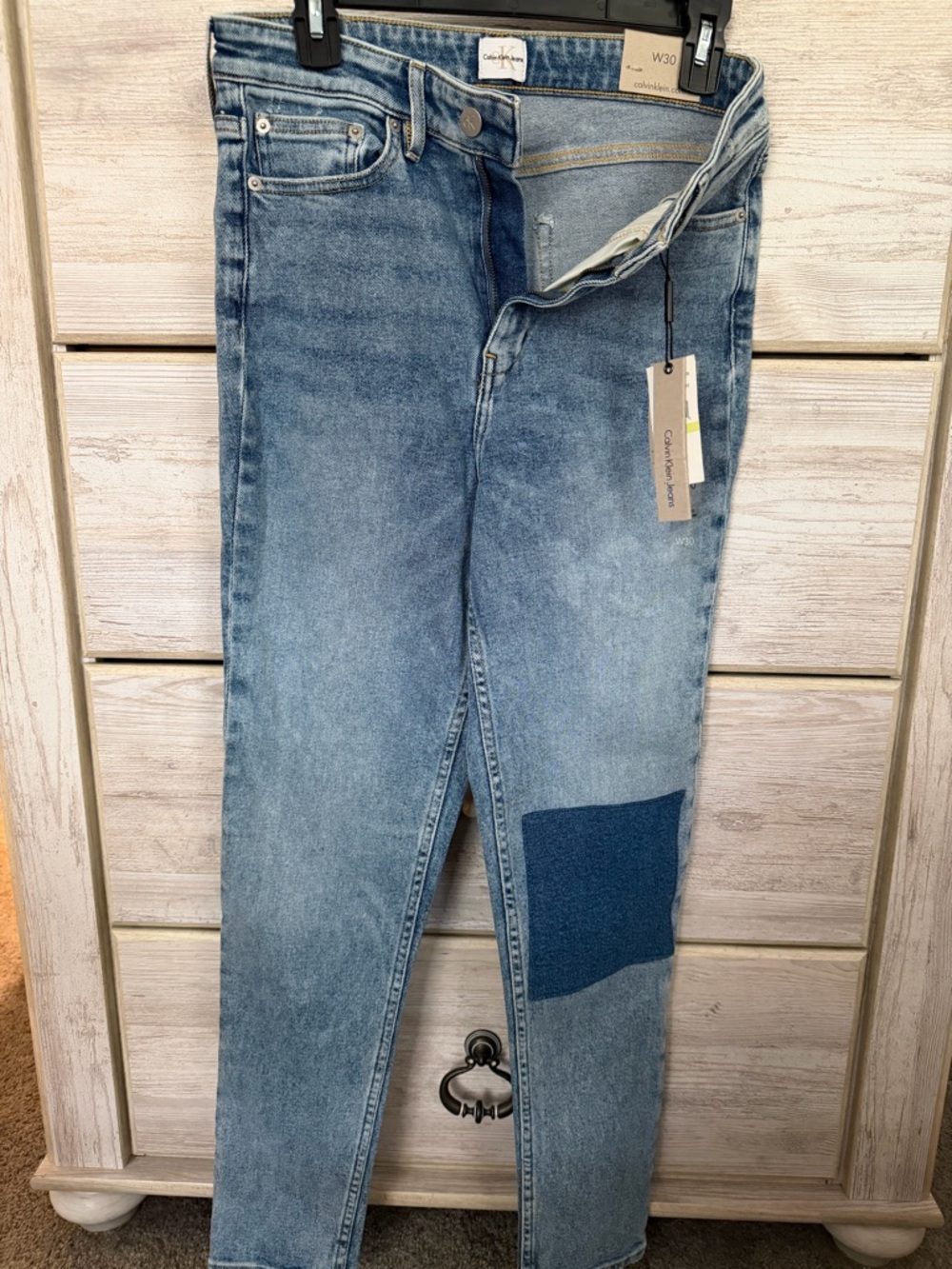 Calvin Klein Light Wash High Rise Ankle Skinny Jeans with Dark Denim Patch